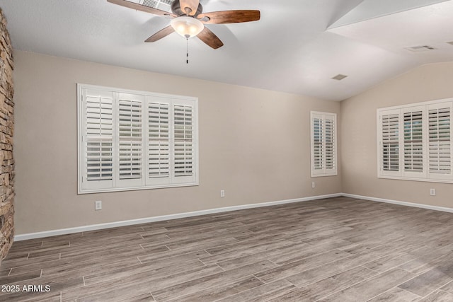 3028 W Parkside Ln, Phoenix, AZ 85027 - spare room with wood finished floors, ceiling fan, vaulted ceiling, and baseboards