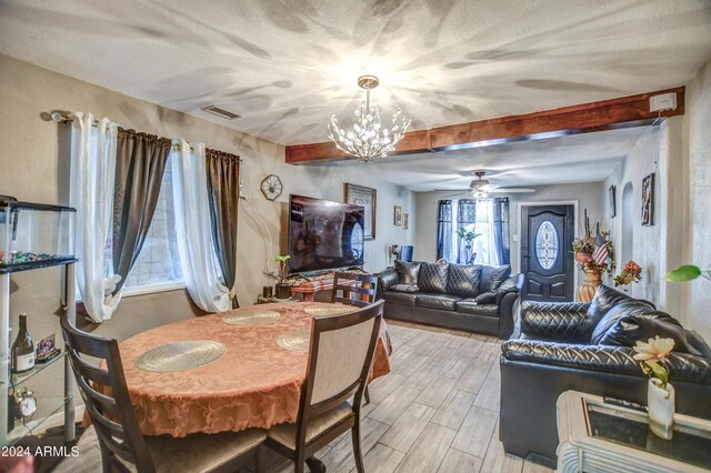 2124 W Maricopa St, Phoenix, AZ 85009 - dining room with a chandelier, ceiling fan, beam ceiling, light wood finished floors, and a textured ceiling