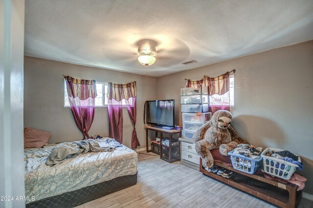 2124 W Maricopa St, Phoenix, AZ 85009 - bedroom with wood finished floors and a ceiling fan