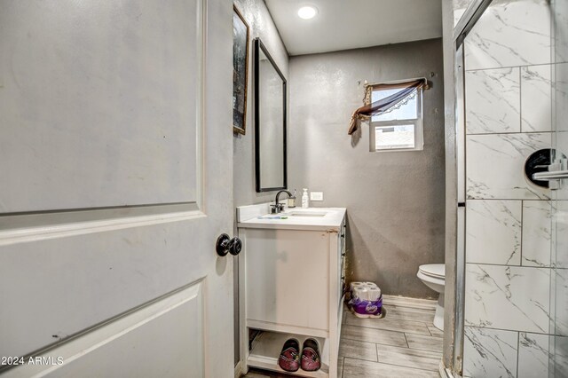 2124 W Maricopa St, Phoenix, AZ 85009 - bathroom with toilet, vanity, and a shower