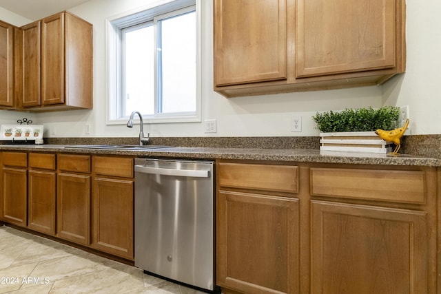 kitchen featuring stainless steel dishwasher and sink