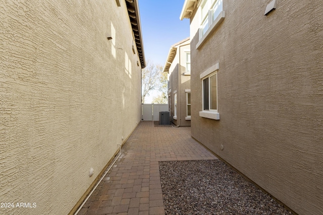 view of property exterior featuring a patio and central air condition unit