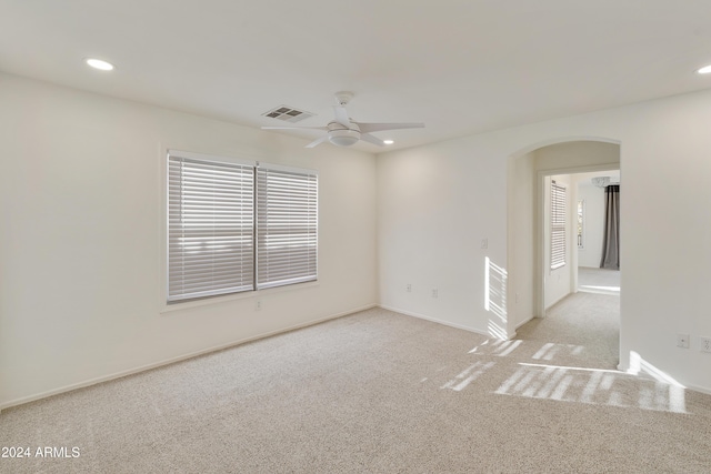 carpeted empty room with ceiling fan