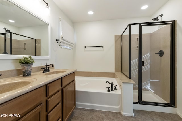 bathroom with plus walk in shower, vanity, and tile patterned floors