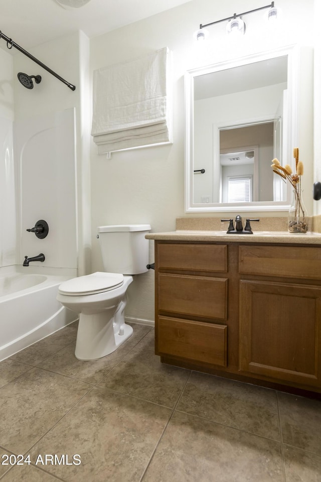 full bathroom featuring tile patterned floors, vanity, toilet, and shower / bath combination