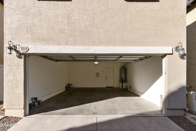 garage featuring secured water heater