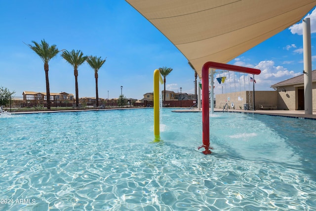 view of pool featuring pool water feature