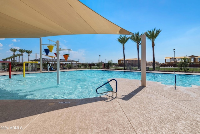 view of pool with pool water feature