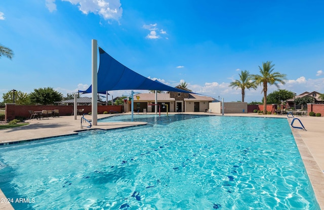 view of swimming pool featuring a patio