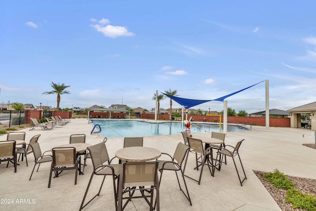 view of swimming pool with a patio