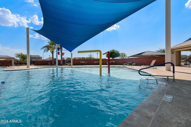 view of swimming pool featuring a patio