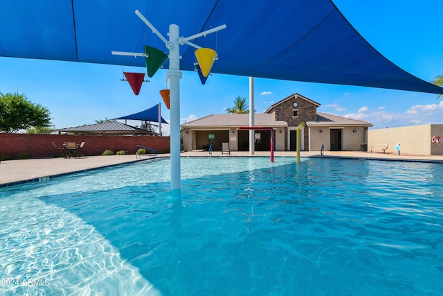 view of pool featuring a patio area