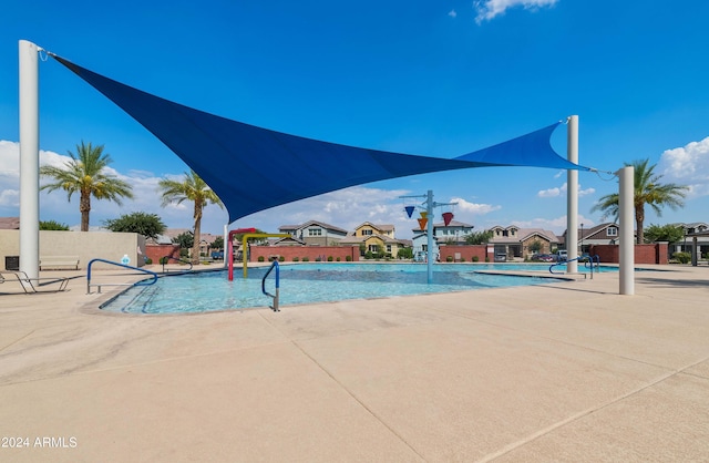 view of swimming pool with a patio area