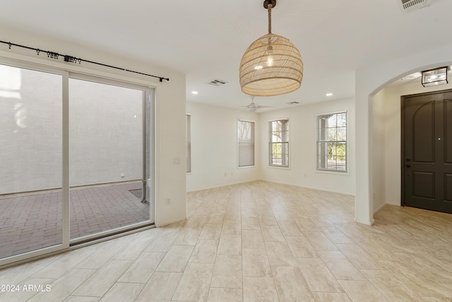 spare room featuring ceiling fan