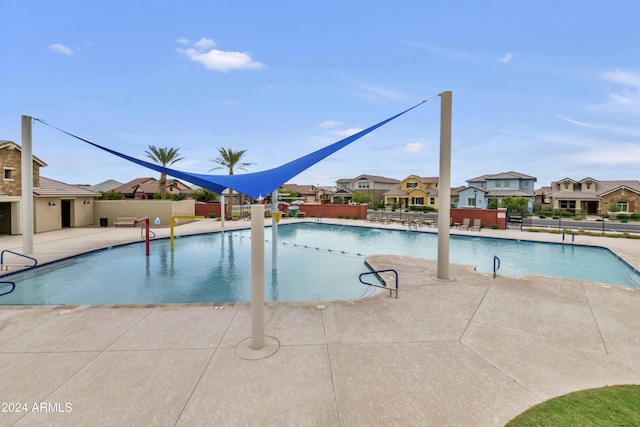 view of swimming pool with a patio area