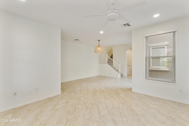 empty room featuring ceiling fan