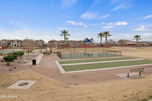 surrounding community with tennis court