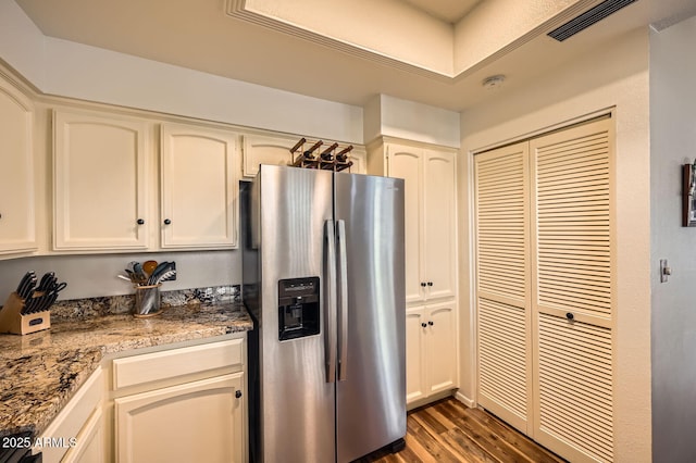 9707 E Mountain View Rd Unit 1408, Scottsdale, AZ 85258 - kitchen with stainless steel fridge with ice dispenser, dark wood-style flooring, and white cabinetry
