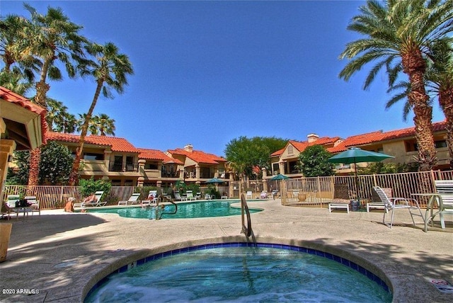 9707 E Mountain View Rd Unit 1408, Scottsdale, AZ 85258 - community pool featuring a community hot tub, a patio area, and fence