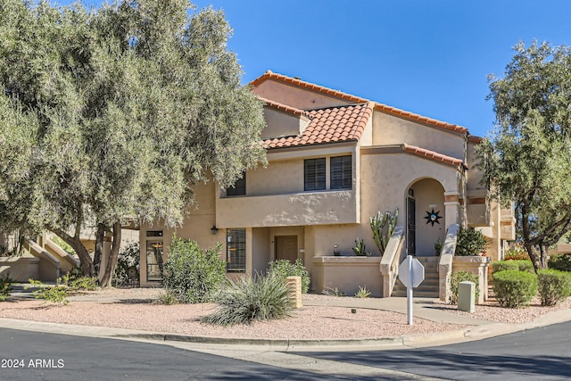 9707 E Mountain View Rd Unit 1408, Scottsdale, AZ 85258 - view of front of house with stucco siding and a tile roof