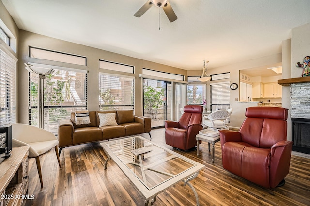 9707 E Mountain View Rd Unit 1408, Scottsdale, AZ 85258 - living room with a ceiling fan, plenty of natural light, hardwood / wood-style flooring, and a fireplace