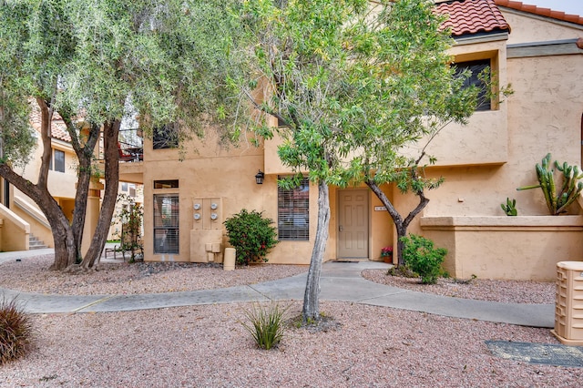 9707 E Mountain View Rd Unit 1408, Scottsdale, AZ 85258 - townhome / multi-family property featuring a balcony, stucco siding, and a tile roof
