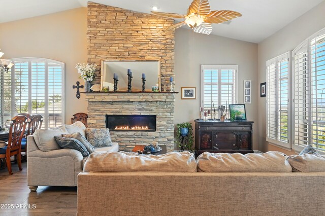 601 E Phoenix St, Payson, AZ 85541 - living room featuring a ceiling fan, a healthy amount of sunlight, wood finished floors, and a fireplace