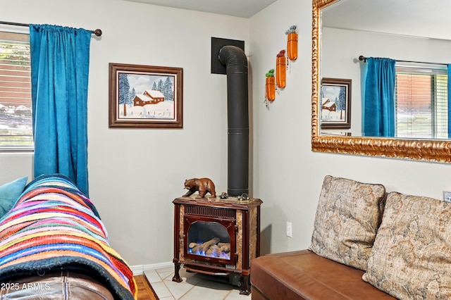 601 E Phoenix St, Payson, AZ 85541 - living area with baseboards, tile patterned flooring, a healthy amount of sunlight, and a wood stove