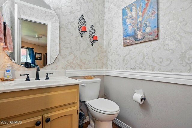 601 E Phoenix St, Payson, AZ 85541 - bathroom featuring toilet, wallpapered walls, and vanity