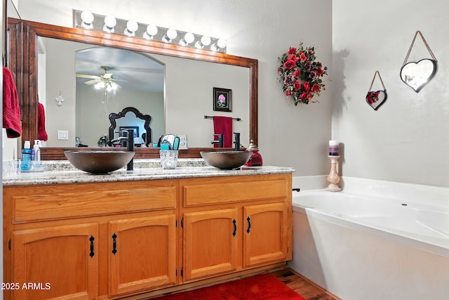 601 E Phoenix St, Payson, AZ 85541 - bathroom featuring a sink, ceiling fan, a garden tub, and double vanity
