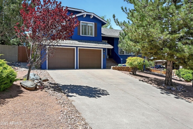 601 E Phoenix St, Payson, AZ 85541 - view of front of home with fence, an attached garage, concrete driveway, and a shingled roof