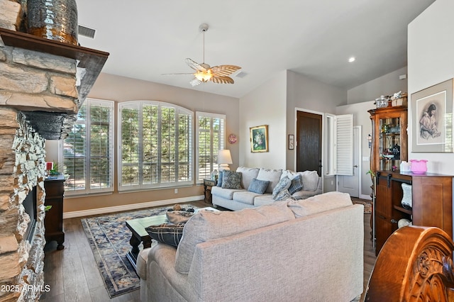 601 E Phoenix St, Payson, AZ 85541 - living area featuring a ceiling fan, a stone fireplace, visible vents, lofted ceiling, and hardwood / wood-style floors
