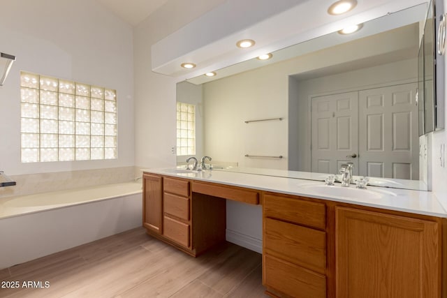 1213 W Beck Ln, Phoenix, AZ 85023 - full bath featuring double vanity, a bath, wood finished floors, and recessed lighting