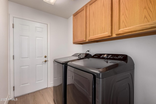 1213 W Beck Ln, Phoenix, AZ 85023 - laundry area featuring cabinet space, washing machine and dryer, and light wood finished floors