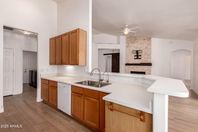 1213 W Beck Ln, Phoenix, AZ 85023 - kitchen featuring white dishwasher, ceiling fan, a peninsula, light wood finished floors, and light countertops