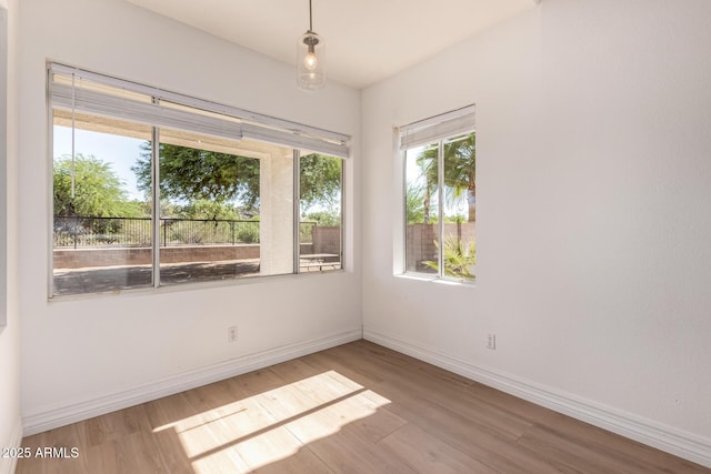 1213 W Beck Ln, Phoenix, AZ 85023 - empty room with wood finished floors and baseboards