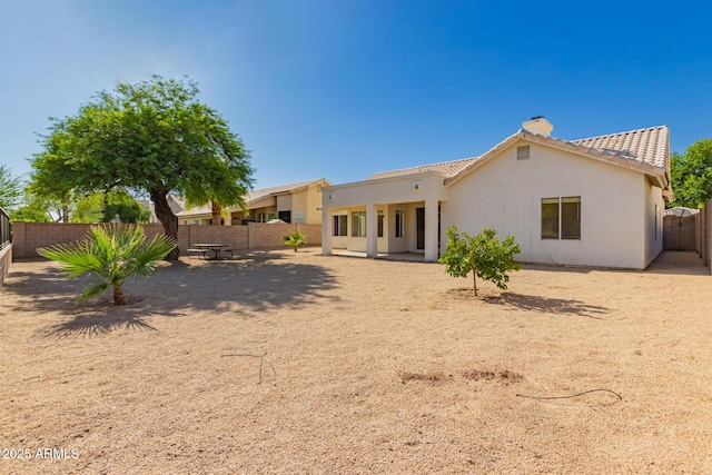 1213 W Beck Ln, Phoenix, AZ 85023 - rear view of property with a chimney, a fenced backyard, a tile roof, and stucco siding