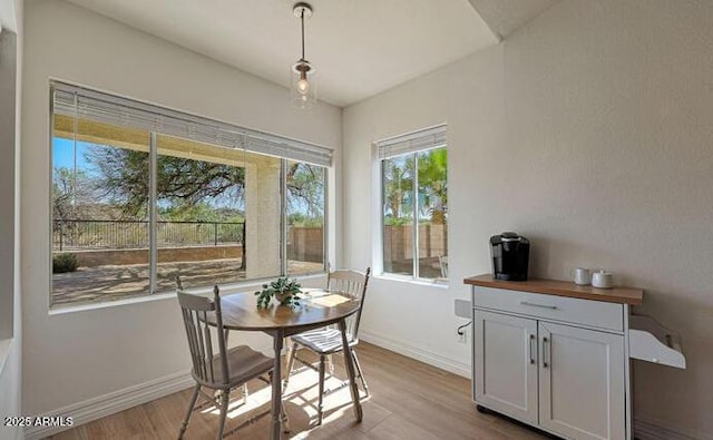 1213 W Beck Ln, Phoenix, AZ 85023 - dining space featuring light wood-style flooring and baseboards