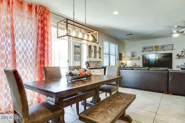 dining room featuring light tile patterned flooring and a ceiling fan