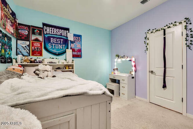 bedroom featuring visible vents, baseboards, and carpet