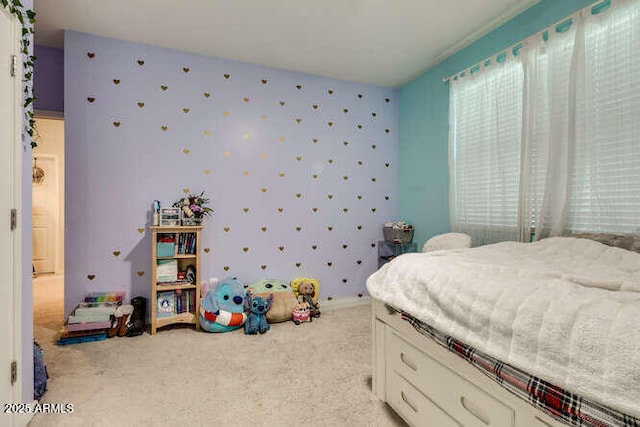 bedroom featuring wallpapered walls and light colored carpet