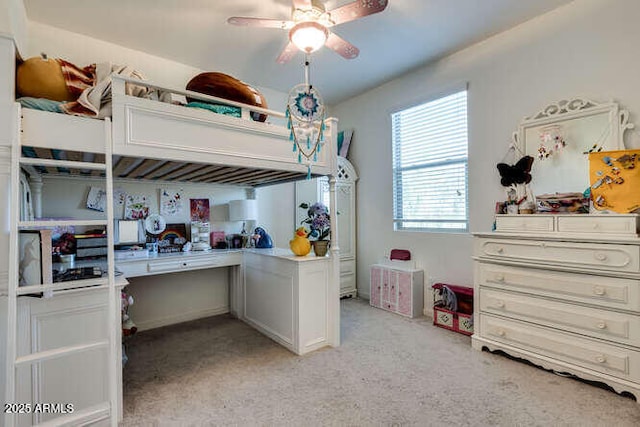 bedroom featuring light carpet and a ceiling fan