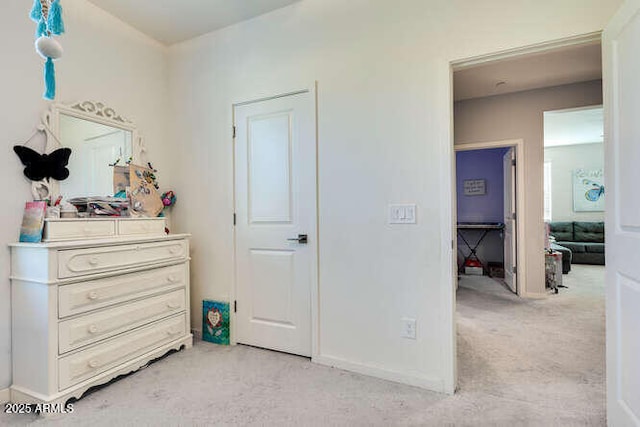 bedroom featuring light colored carpet