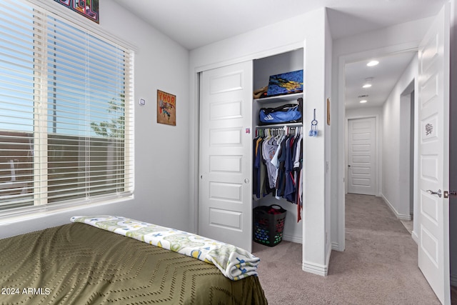 carpeted bedroom featuring a closet