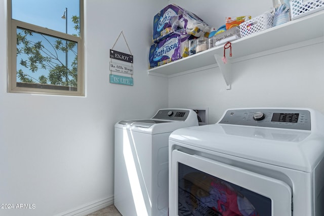 clothes washing area featuring washing machine and dryer