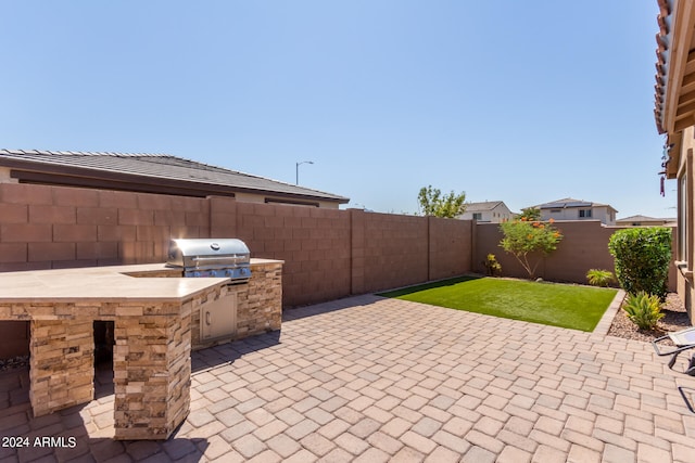 view of patio with area for grilling and grilling area