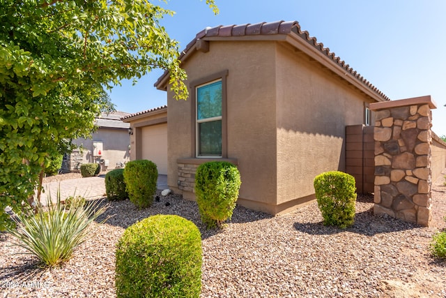 view of side of property featuring a garage