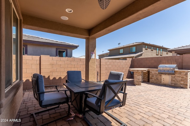 view of patio / terrace with exterior kitchen and area for grilling