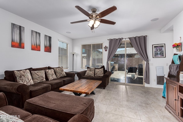 tiled living room with ceiling fan and a wealth of natural light