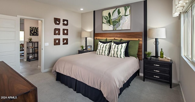 bedroom featuring light carpet